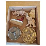 Box of collectibles, elephants, (one broke leg), brass US seal hot plate, napkin holder and more.