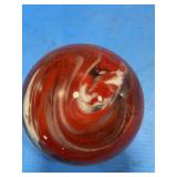 Red swirling paperweight