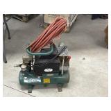 ROL-AIR 3/4 H.P. Air compressor with hose.