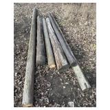 Stack of wood posts, various sizes