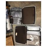 2 Samsonite suitcases with blankets inside