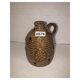 Stone jug with pineapple