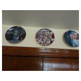 Three Military Collectible Plates on Wall