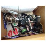 Four Fishing Reels and Stickers