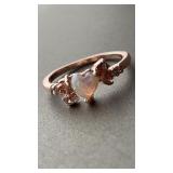 Rose gold colored ring, heart shaped opalescent