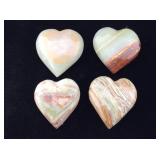 4 carved onyx stone hearts.