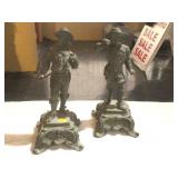 2 metal figure statues on stands. 14x6x6