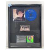 Whitney Houston platinum sales award display