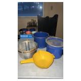 Lot of bakeing dishes and pot with strainer