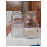 2 LARGE SEALED GLASS JARS