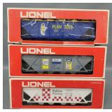 Three Lionel modern O billboard hoppers in original boxes