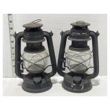 2 black oil lanterns