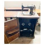 Treadle Sewing Machine in Oak Cabinet