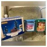 3 Christmas Decorations for under your tree a Lemax Battery Operated Merry-go-round with two Smaller Houses
