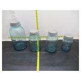 4 blue glass jars