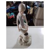 Female and cat figurine marked f