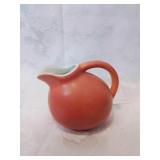 Orange ceramic bulbus creamer