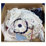 Box of vintage doilies