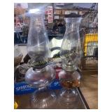 2 clear oil lamps