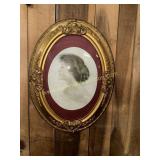 Portrait in convex oval frame