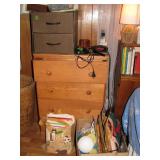 Wooden chest of drawers with misc bedroom decor