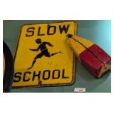 SLOW SCHOOL SIGN AND BUOY