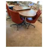 Oval table 48 x 36 with a leaf and three chairs