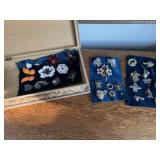 Broaches in wooden jewelry box