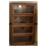 Four shelf glass bookcase 33 x 13 x 60 tall