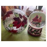 Poinsettia light and cardinal snow globe