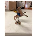 Metal cowboy on horse