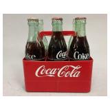 Vintage Coca-Cola Glass Bottles in Plastic Carrier