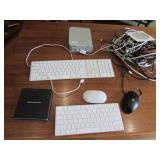 2 apple keyboards,cords & items