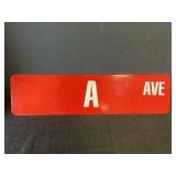 Metal, reflective, A Ave intersection sign