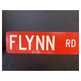 Metal, reflective, Flynn Rd intersection sign