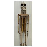 Wood carved skeleton wind chime, approx 30 in