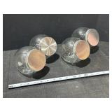 Set of four clear glass candy jars, small