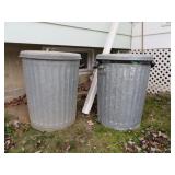 2 metal garbage cans with lids