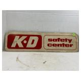 K D SAFETY CENTER MASONITE SIGN - 24" X 6 1/2"