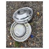 Six oldsmobile hubcaps