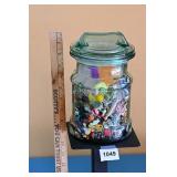 Glass jar of gumball machine prizes