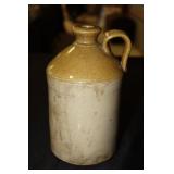 Glazed stoneware whiskey jug with mustard color