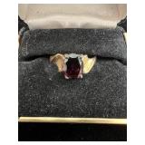 Ring with red stone marked 925 inside size 8.75