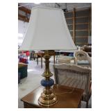 Brass table lamp with blue mid section with shade