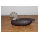 Miniature black duck carving made of balsa and a