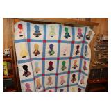 Homemade quilt decorated with little girl with