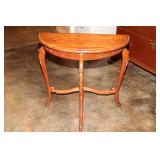 Mahogany half moon side table with detailed