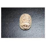 Egyptian scarab beetle with hieroglyphics