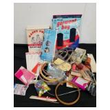 Assorted sewing and crafting items, some are