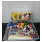 Storage box with paints and colors of the world